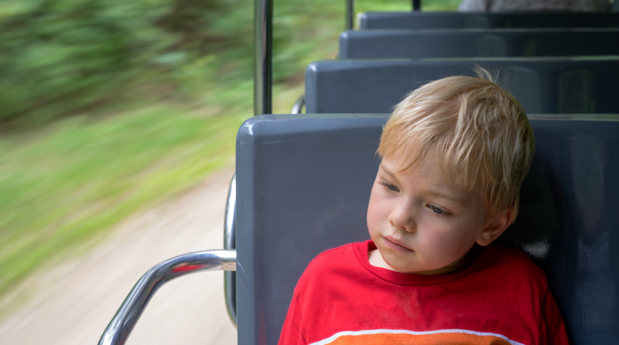 Image of a boy on a tram.